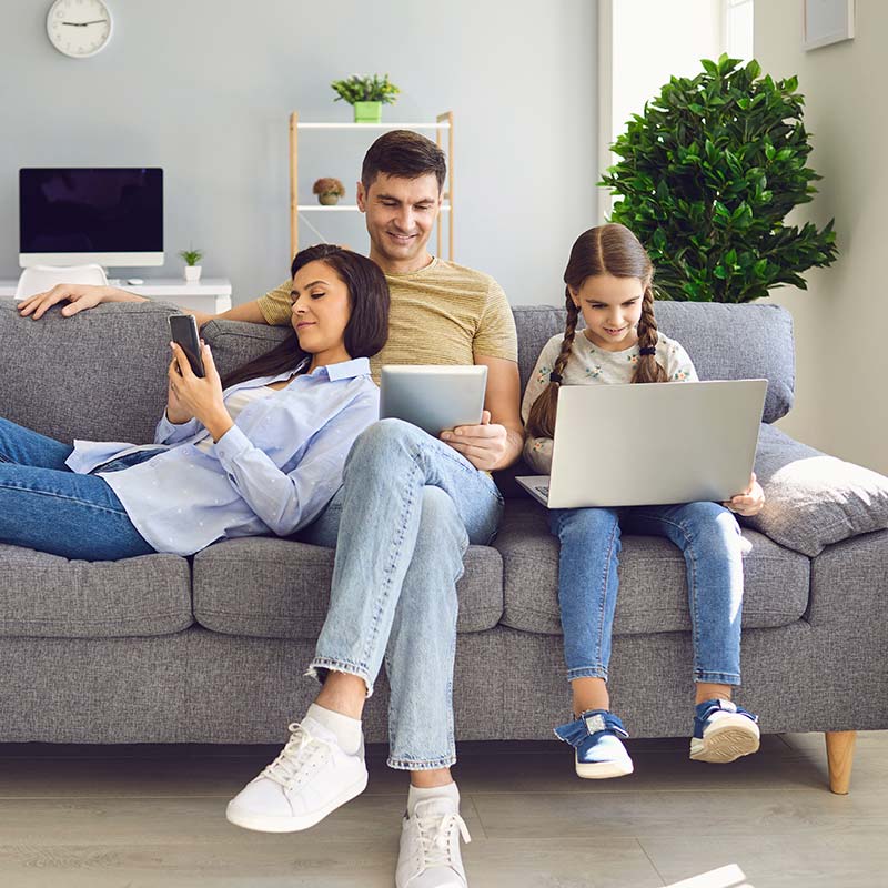 Grandmother with grandchildren using laptop